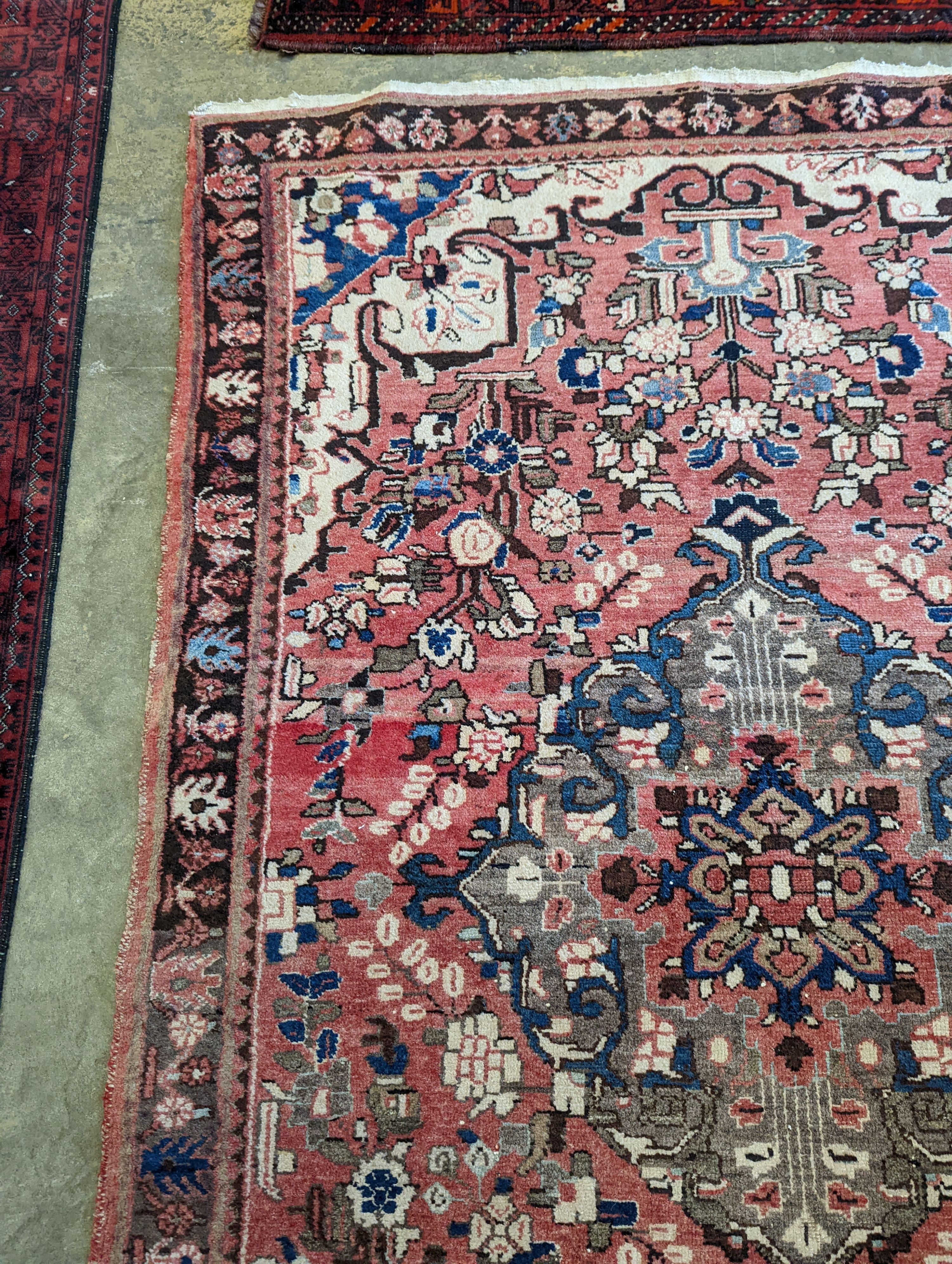 A North West Persian peach ground rug, 240 x 140cm